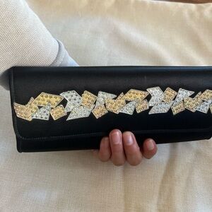 St. John black fabric clutch with silver and gold-toned crystal embellishments